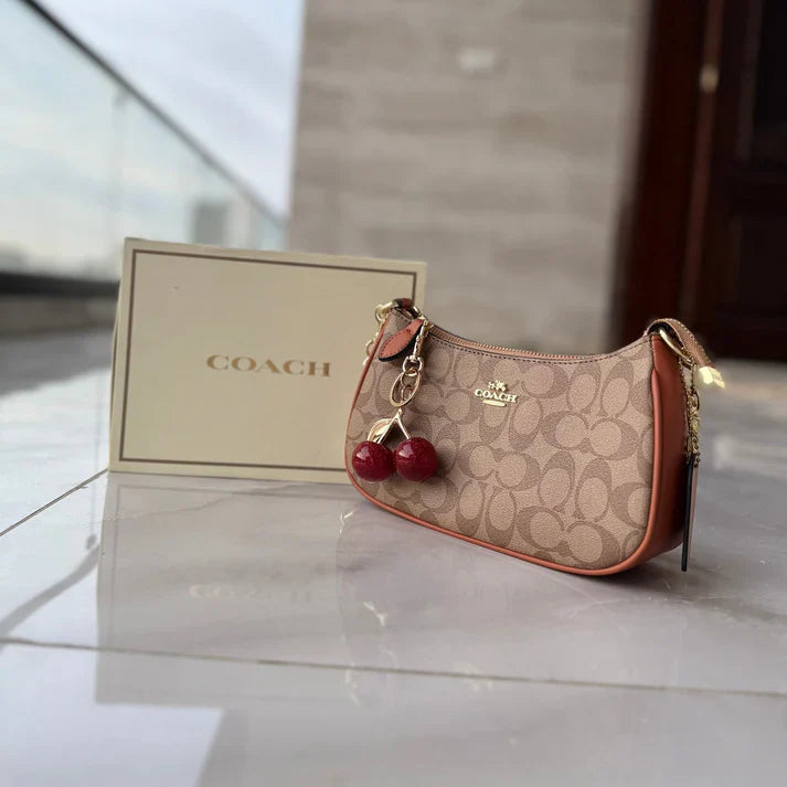COACH CHERRY CHARM BAG (BROWN)